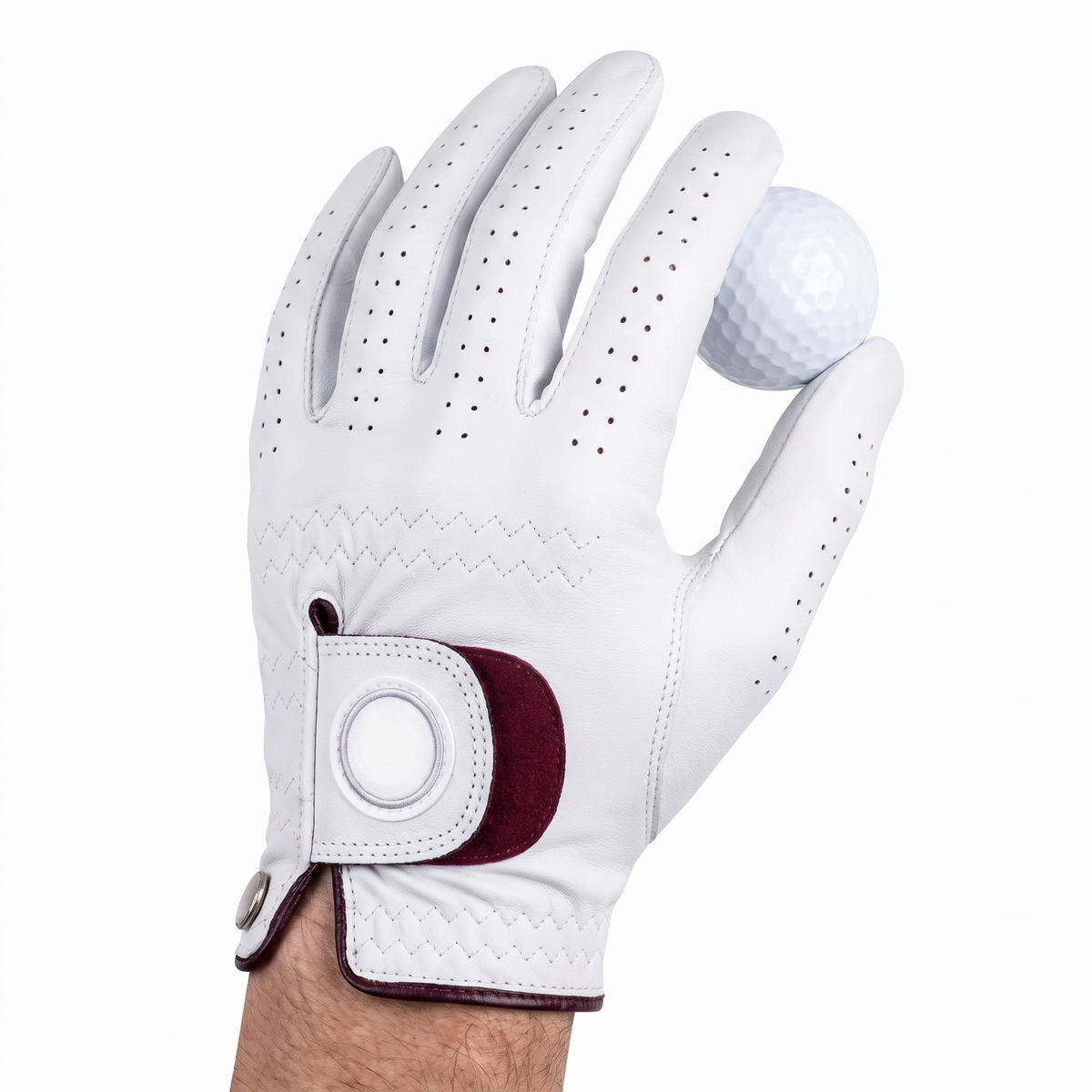Hand wearing the Murbie Fairway G5 golf glove holding a golf ball